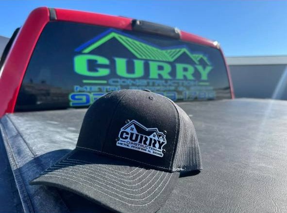 Curry Construction Services LLC branding on truck and hat