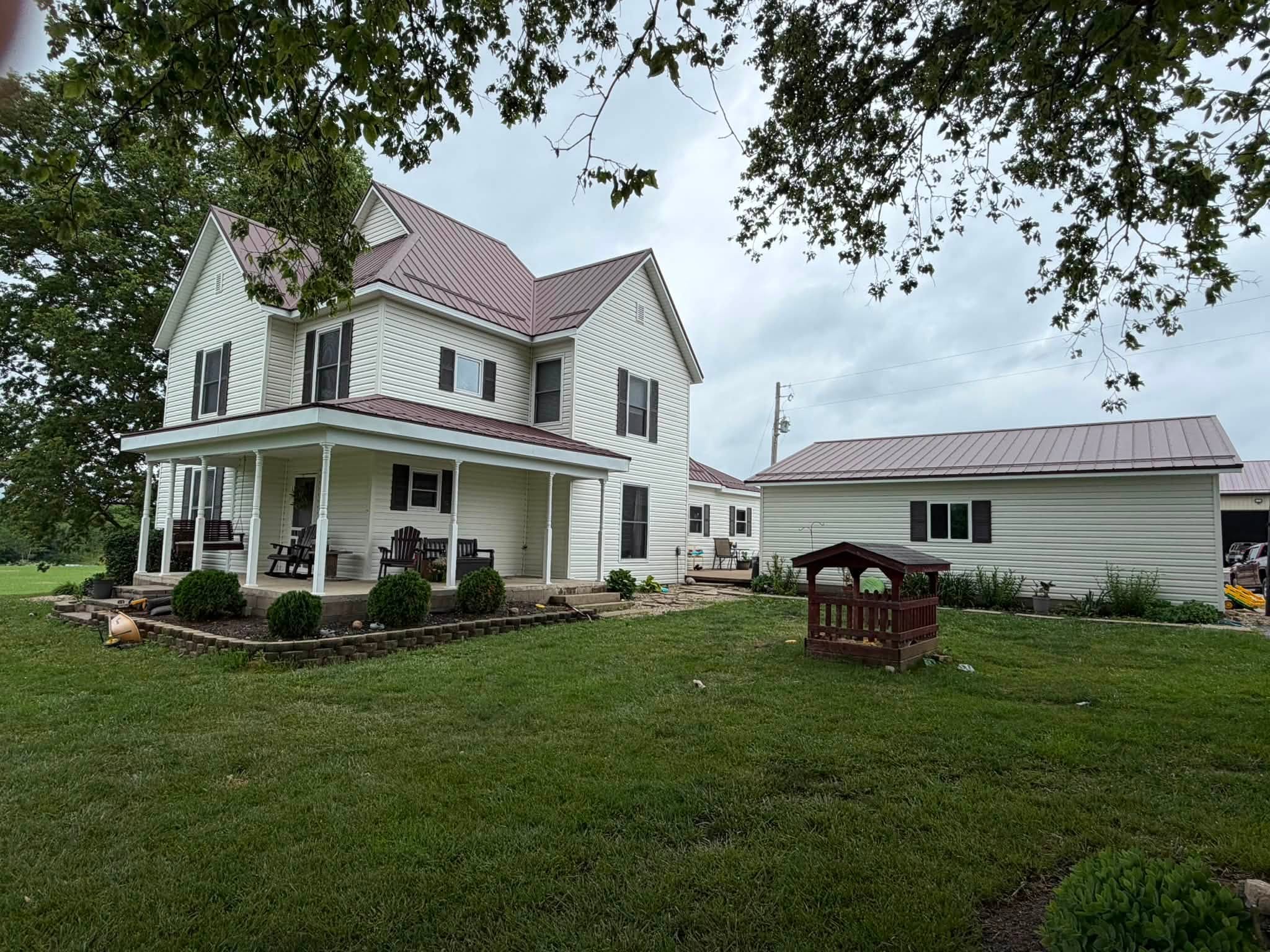Finished exterior and metal roof project by Curry Construction Services LLC
