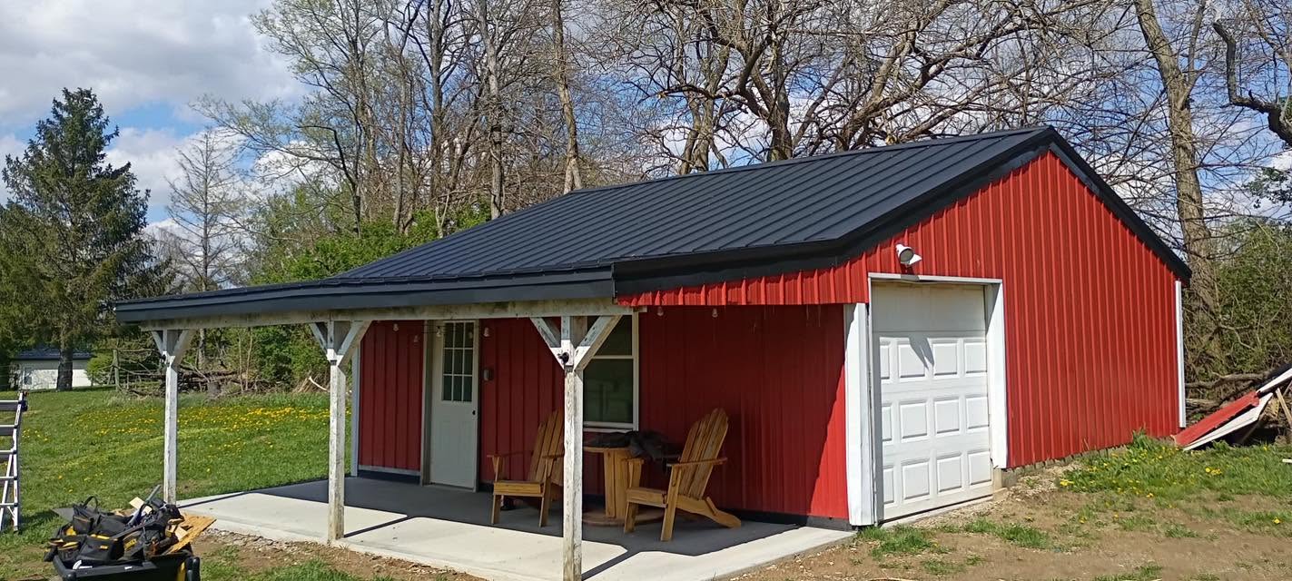 Red barn porch with finished black roof