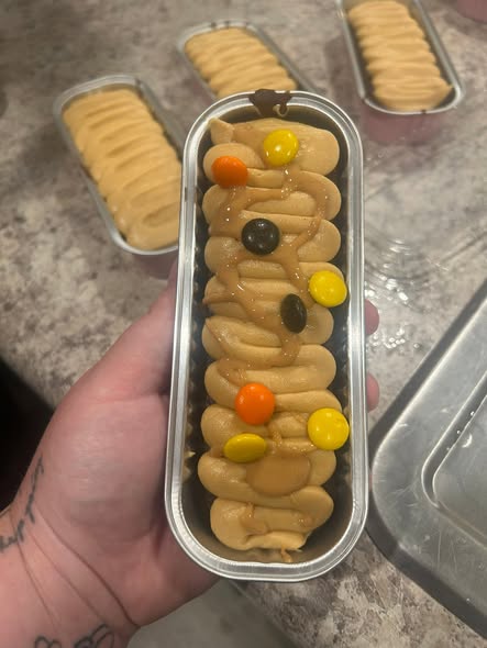 A dessert tin topped with assorted cookie bites