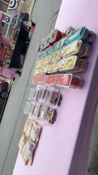 Packaged desserts arranged on an event table