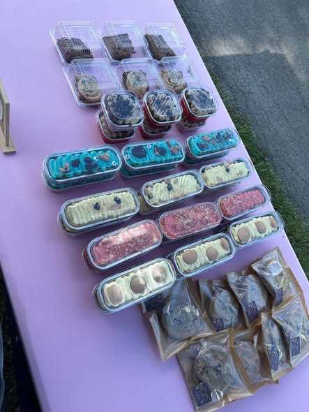 A side view of packaged desserts on a vendor table