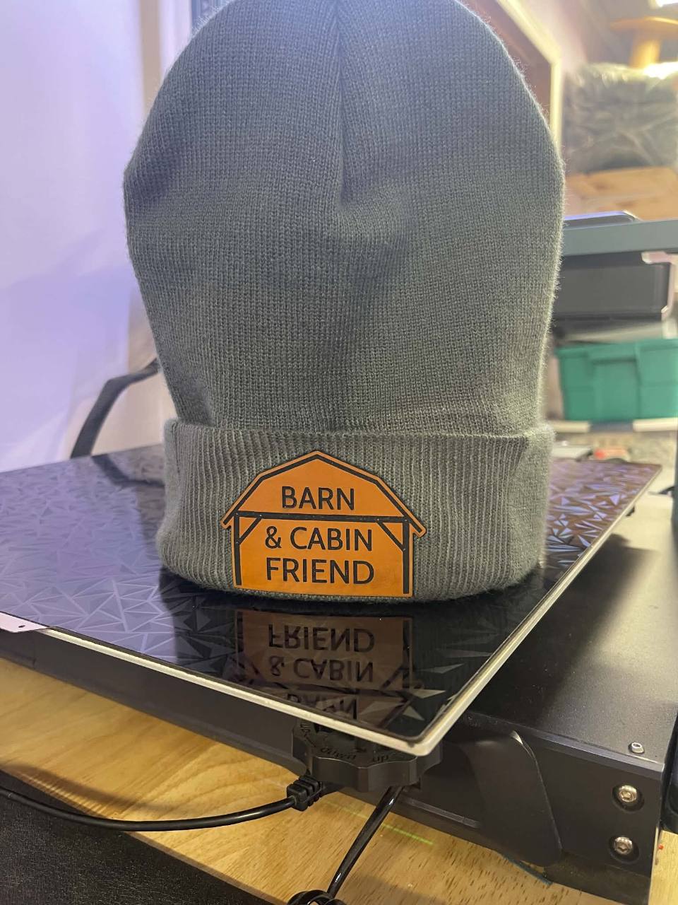 Gray beanie with Barn and Cabin Friend patch
